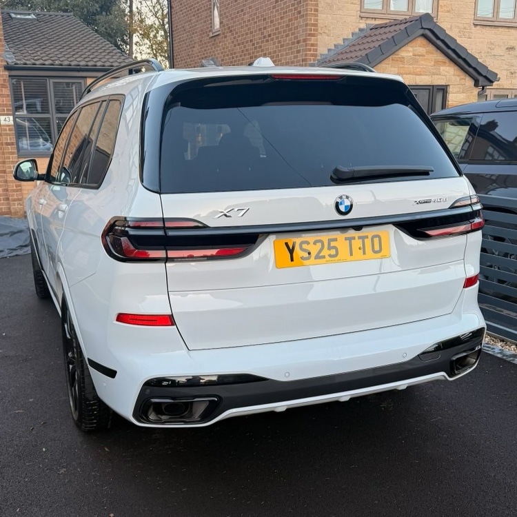BMW X7 after — bright white finish professionally cleaned and refreshed with gleaming clean panels