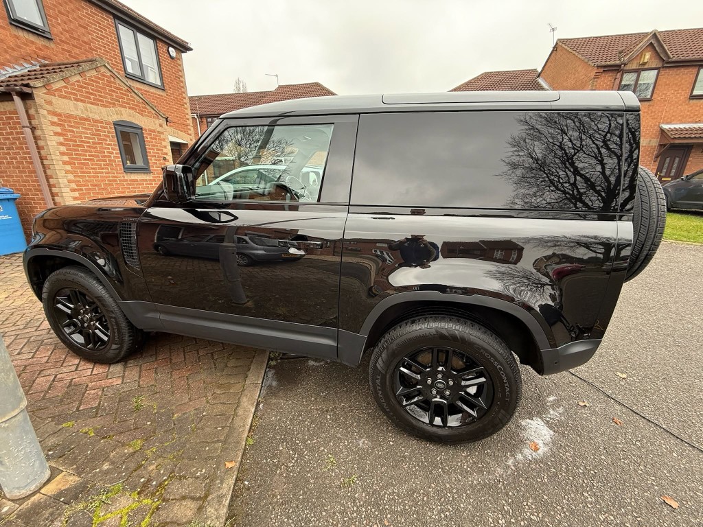Land Rover Defender 90 after — deep gloss black finish, tyres dressed, gloss and presentation enhanced
