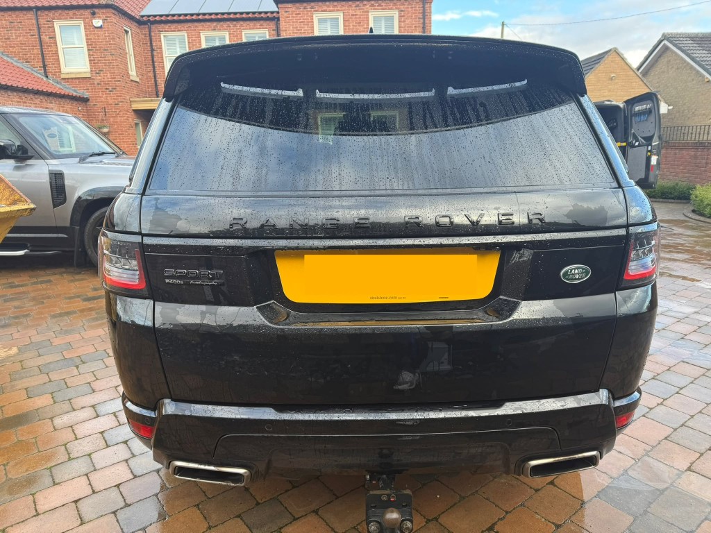 Range Rover Sport after — deep gloss black finish, clean badges, exhausts and bodywork professionally refreshed