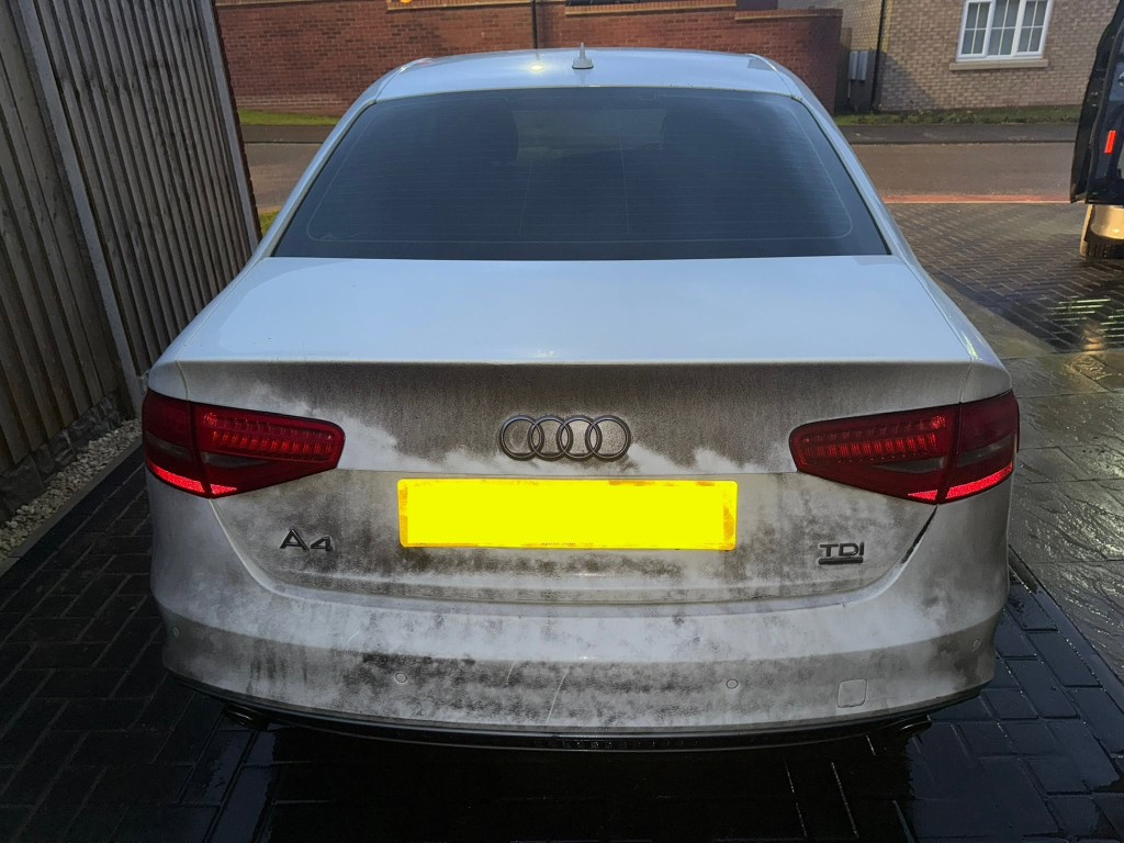 Audi A4 TDI before — rear covered in heavy grime and dirt, dull paintwork